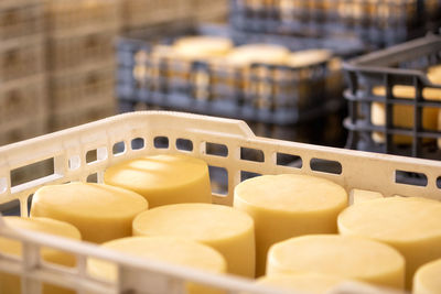 Close-up of yellow crate in container