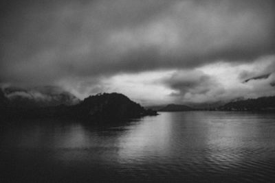 Scenic view of lake against dramatic sky