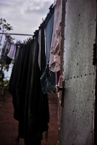 Close-up of clothes drying against wall