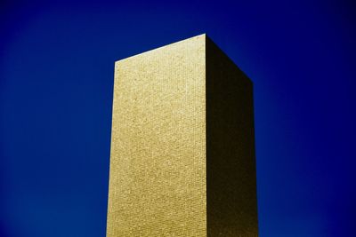 Low angle view of building against blue sky