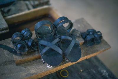 High angle view of old shoes on table