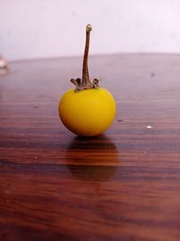 Close-up of yellow fruit on table