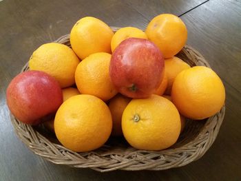 High angle view of fruits in basket on table