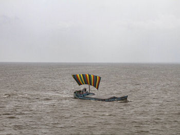 Boat in sea against sky