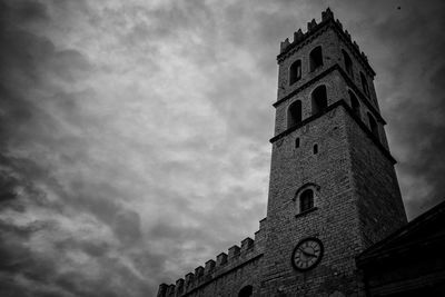 Low angle view of clock tower against sky