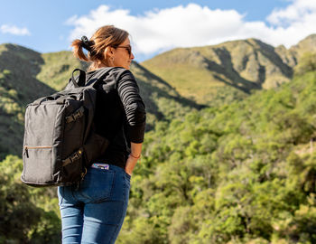 Rear view of man standing on mountain