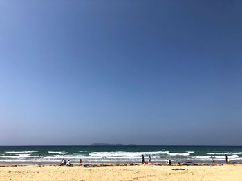 Scenic view of beach against clear sky