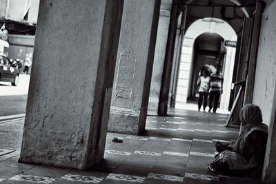 Man sitting in city