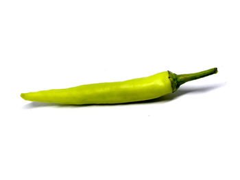 Close-up of green pepper against white background