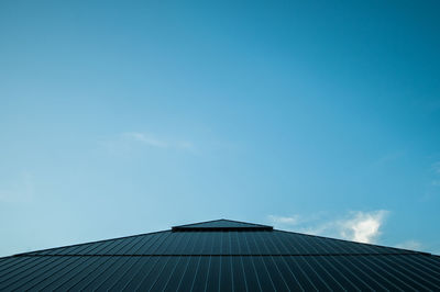 Low angle view of building against blue sky