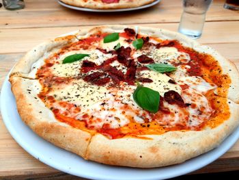 Close-up of pizza served on table