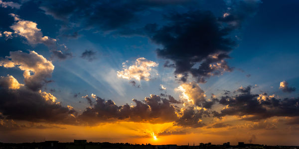 Low angle view of dramatic sky during sunset