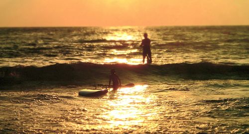 Silhouette of people on beach