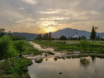 Scenic view of landscape against sky during sunset