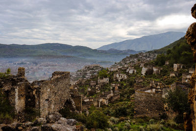 Scenic view of mountains against cloudy sky