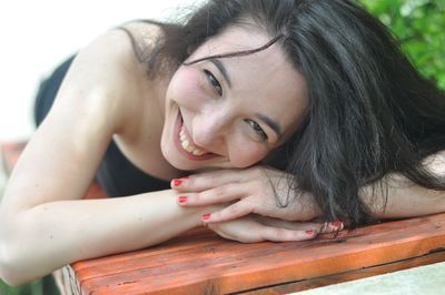 Close-up portrait of smiling young woman