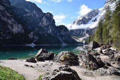 Scenic view of lake and mountains against sky