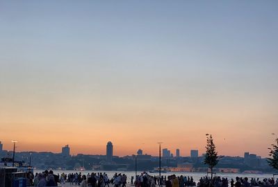 Buildings in city during sunset