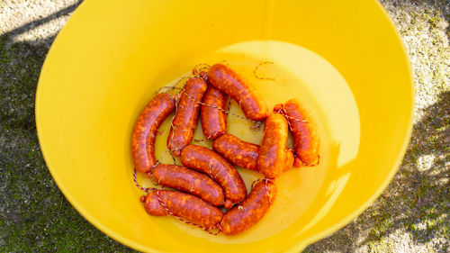 Sausages in a plastic drum