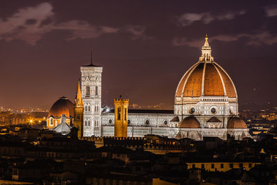 Illuminated cathedral against sky at night