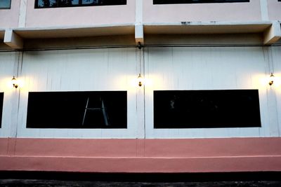 Full frame shot of window with reflection of building