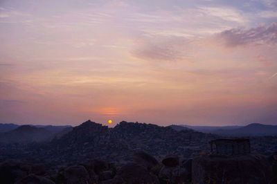 Scenic view of mountains against sky during sunset