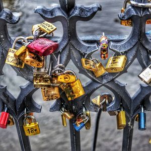 Close-up of padlocks hanging on metal