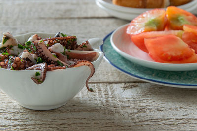 Close-up of fruits in plate on table