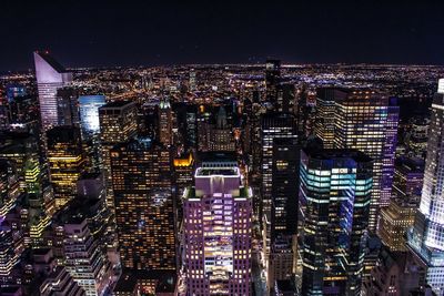 Aerial view of illuminated cityscape at night