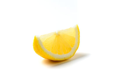 Close-up of orange fruit against white background