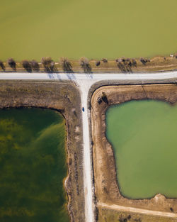 High angle view of road amidst land against sky