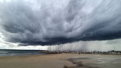 Scenic view of sea against storm clouds