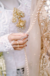 Midsection of wedding dress