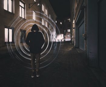 Woman in illuminated city