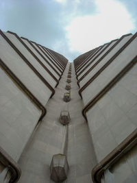 Low angle view of building against cloudy sky