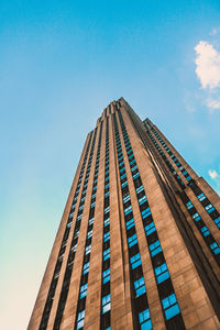 Low angle view of modern building against clear blue sky