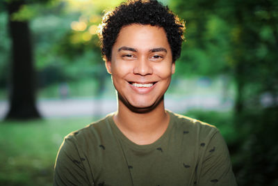 Portrait of smiling young woman standing outdoors