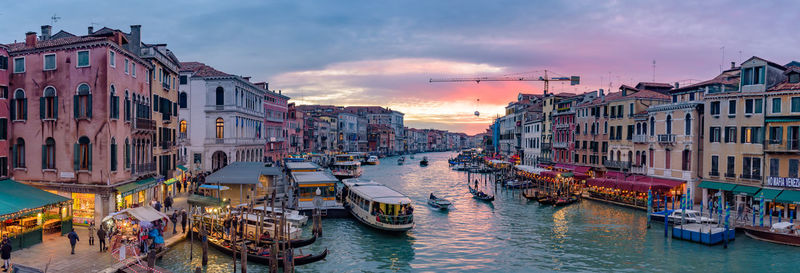 High angle view of canal amidst buildings in city