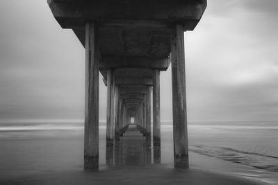 Pier over sea against sky