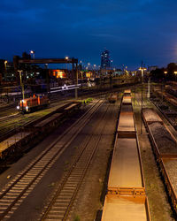 High angle view of railroad tracks at night