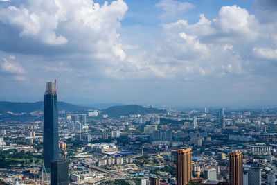 High angle view of city buildings against sky