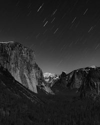 Low angle view of mountain against sky at night