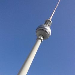 Low angle view of tower against blue sky