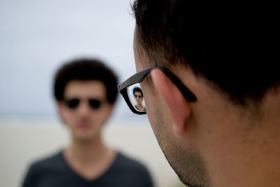 Close-up of young man looking away