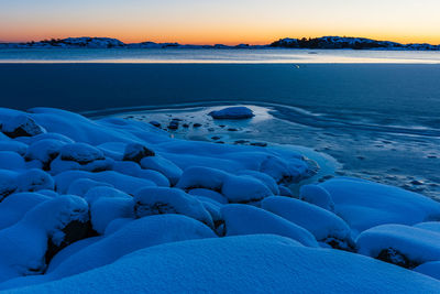 Scenic view of sea against clear sky during sunset