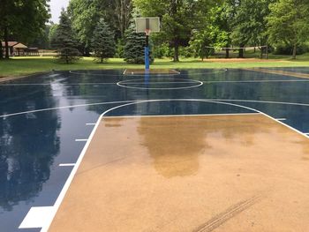 Scenic view of wet basketball court