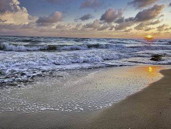 Scenic view of sea against sky during sunset