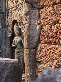 Statue against wall