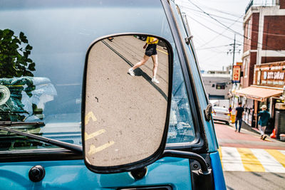 Low section of woman reflecting on mirror