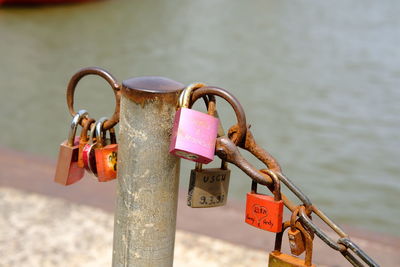 Close-up of padlocks on railing